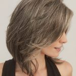 Elegant layered short wig in ash blonde with subtle highlights.